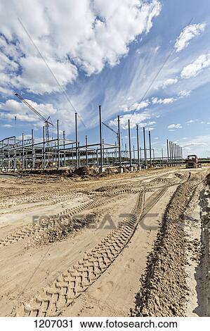 Construction vehicle tracks beside construction frame View Large Photo Image Stock Image - Construction vehicle tracks beside construction frame. Fotosearch