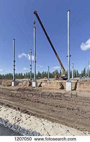 Crane and steel beams at construction site View Large Photo Image Stock Image - Crane and steel beams at construction site. Fotosearch