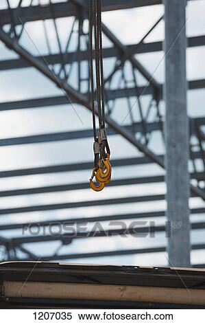 Crane Hook with construction frame in the background View Large Photo Image Stock Photography - Crane Hook with construction frame in the background. Fotosearch