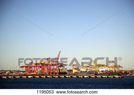 Stock Image - Cranes on a commercial dock. Fotosearch