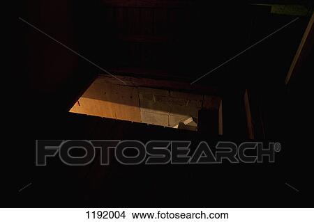Dark attic with light seen through door View Large Photo Image Picture - Dark attic with light seen through door. Fotosearch