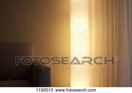 Detail of a light, sofa and curtain in a living room View Large Photo Image Stock Image - Detail of a light, sofa and curtain in a living room. Fotosearch