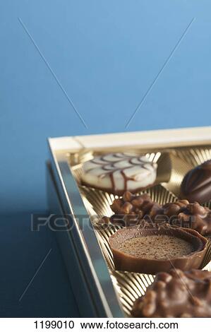Detail of chocolates in a box View Large Photo Image Stock Image - Detail of chocolates in a box. Fotosearch