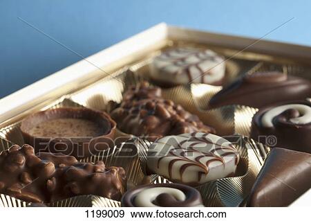 Detail of chocolates in a box View Large Photo Image Stock Photo - Detail of chocolates in a box. Fotosearch