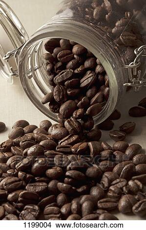 Detail of coffee beans spilling from a jar View Large Photo Image Picture - Detail of coffee beans spilling from a jar. Fotosearch