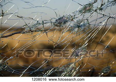Detail of holes in a windshield View Large Photo Image Stock Photograph - Detail of holes in a windshield. Fotosearch