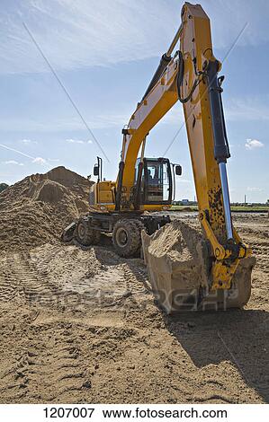 Stock Photo - Digger scoop full of sand. Fotosearch