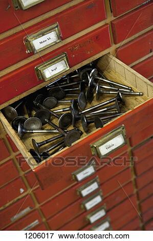 Drawer of motorcycle valves View Large Photo Image Stock Photo - Drawer of motorcycle valves. Fotosearch