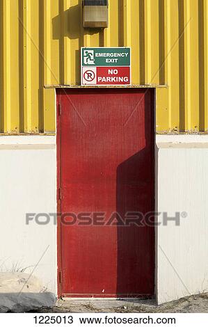 'Emergency Exit' and 'No Parking' signs above door View Large Photo Image Stock Image - 'Emergency Exit' and 'No Parking' signs above door. Fotosearch