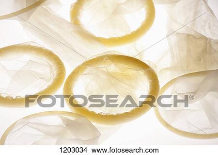 Five used condoms in a heap, back lit View Large Photo Image Picture - Five used condoms in a heap, back lit. Fotosearch