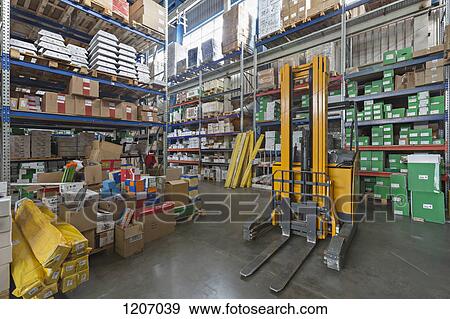 Forklift in warehouse View Large Photo Image Stock Photo - Forklift in warehouse. Fotosearch