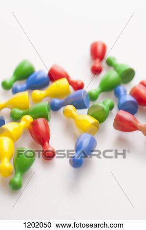 Stock Image - Game pieces falling, blurred motion. Fotosearch