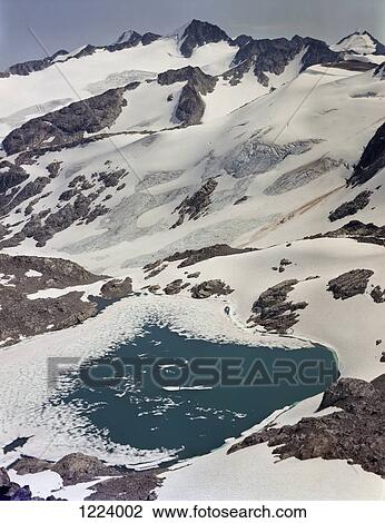 Stock Image - Glacial lake on Blackcomb Mountain, Whistler, Canada . Fotosearch