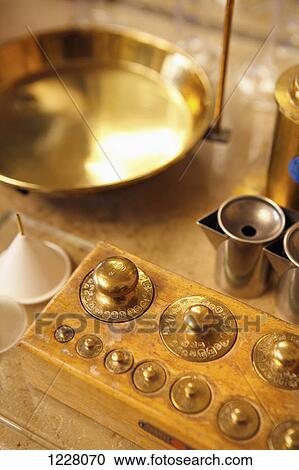 Gold weights and other equipment at a perfumery View Large Photo Image Stock Image - Gold weights and other equipment at a perfumery. Fotosearch