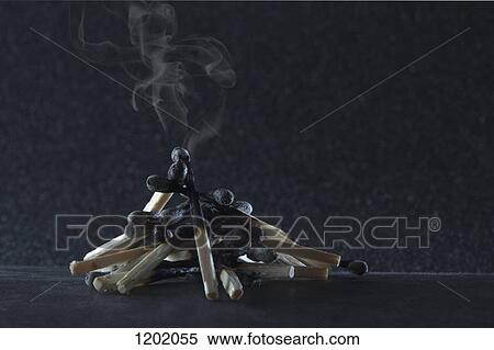 Stock Photography - heap of smoldering used matches. Fotosearch