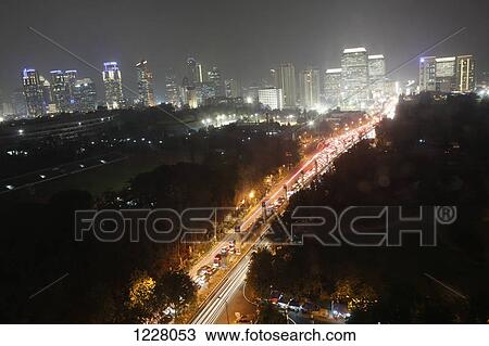 Stock Image - High angle view of the city streets of Jakarta at night, Indonesia. Fotosearch