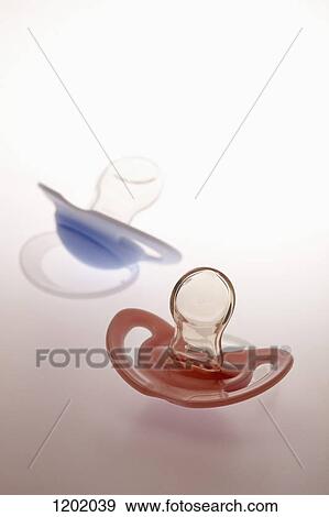 His and hers pacifiers View Large Photo Image Stock Photo - His and hers pacifiers. Fotosearch