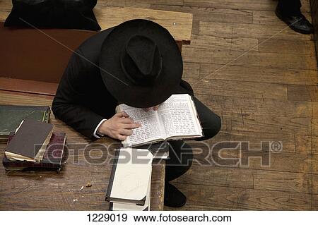 Jewish man reading religious text View Large Photo Image Stock Photo - Jewish man reading religious text . Fotosearch