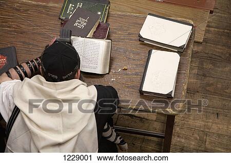 Jewish man with tefillin reading religious prayer book View Large Photo Image Stock Image - Jewish man with tefillin reading religious prayer book. Fotosearch