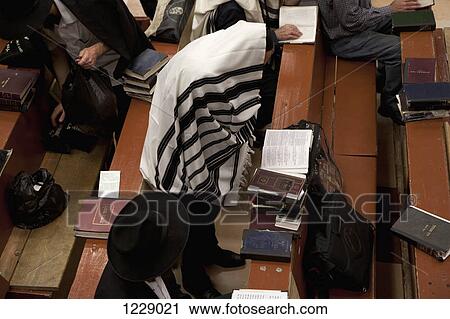 Jewish men in traditional clothing reading religious text View Large Photo Image Stock Image - Jewish men in traditional clothing reading religious text. Fotosearch