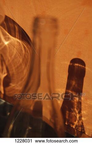 Light refraction and a glass bottle shadow making an abstract pattern on a wall View Large Photo Image Stock Image - Light refraction and a glass bottle shadow making an abstract pattern on a wall. Fotosearch