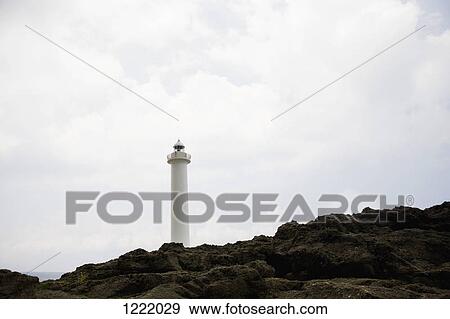 Stock Photo - Lighthouse at Cape Zampa in Okinawa, Japan. Fotosearch