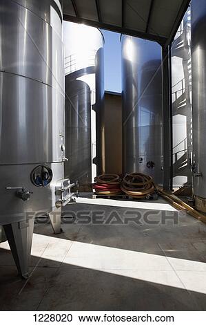 Modern stainless steel wine tanks at a winery View Large Photo Image Stock Image - Modern stainless steel wine tanks at a winery. Fotosearch