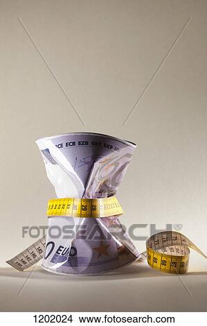 Money can measured with measuring tape View Large Photo Image Picture - Money can measured with measuring tape . Fotosearch