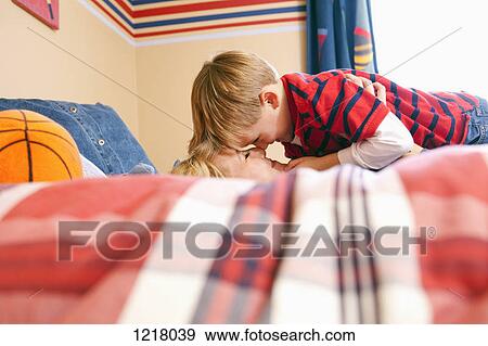 Stock Photo - Mother and son rubbing noses. Fotosearch