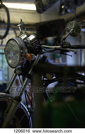 Motorbike in workshop View Large Photo Image Stock Photograph - Motorbike in workshop. Fotosearch