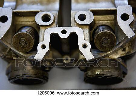 Motorbike valves in a cylinder head View Large Photo Image Stock Photograph - Motorbike valves in a cylinder head. Fotosearch