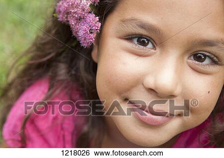 Portrait of girl with flowers in her hair View Large Photo Image Stock Photograph - Portrait of girl with flowers in her hair. Fotosearch
