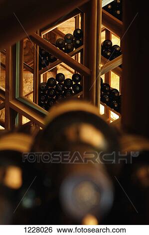 Racks of wine bottles View Large Photo Image Stock Photograph - Racks of wine bottles . Fotosearch