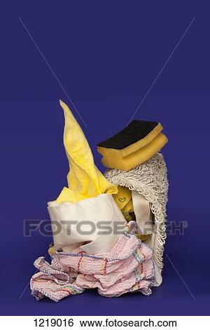 Stock Photograph - Rags and sponges used for cleaning arranged into an abstract shape. Fotosearch
