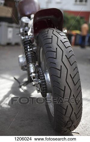 Picture - Rear tire of motorcycle. Fotosearch