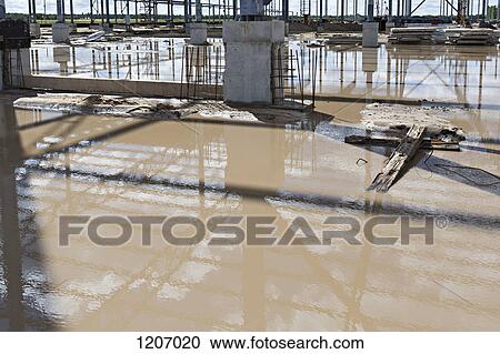 Reflection of construction frame on construction site View Large Photo Image Stock Image - Reflection of construction frame on construction site. Fotosearch