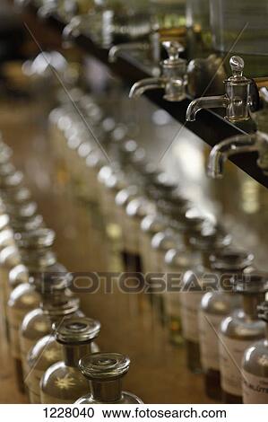 Rows of glass bottles at a perfumery View Large Photo Image Stock Image - Rows of glass bottles at a perfumery. Fotosearch