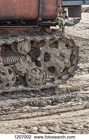 Rusted metal treads on a backhoe View Large Photo Image Stock Image - Rusted metal treads on a backhoe. Fotosearch