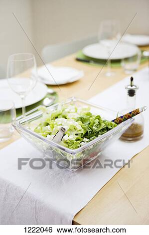 Salad bowl on dining table View Large Photo Image Stock Photograph - Salad bowl on dining table. Fotosearch