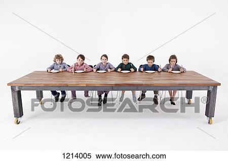 Six angry kids holding knives and forks impatiently waiting for food View Large Photo Image Stock Photography - Six angry kids holding knives and forks impatiently waiting for food. Fotosearch
