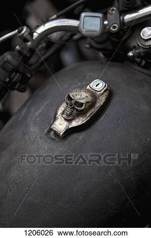 Skull design on motorcycle ignition View Large Photo Image Stock Photograph - Skull design on motorcycle ignition. Fotosearch