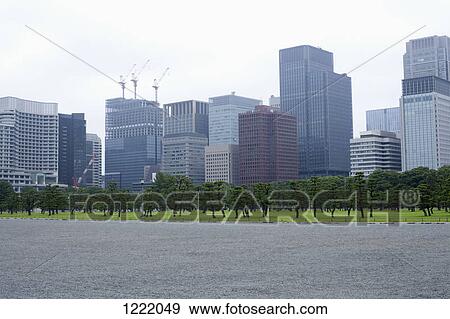 Skyscrapers in marunouchi business district viewed from outer gardens of Imperial Palace, Tokyo View Large Photo Image Stock Photo - Skyscrapers in marunouchi business district viewed from outer gardens of Imperial Palace, Tokyo. Fotosearch
