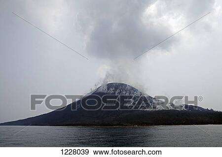 Stock Photo - Smoking rising off Krakatau volcano, Indonesia. Fotosearch