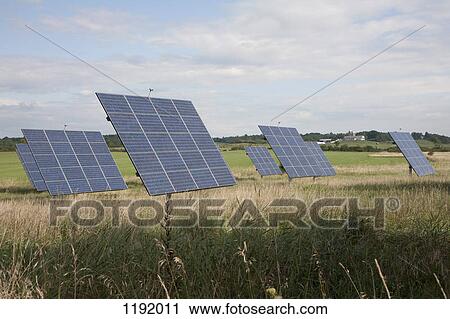 Solar panels in a field View Large Photo Image Stock Image - Solar panels in a field. Fotosearch