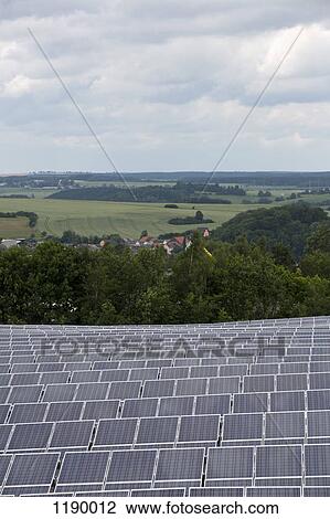 Solar panels in front of natural landscape View Large Photo Image Stock Image - Solar panels in front of natural landscape. Fotosearch