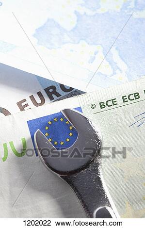 Spanner turning the stars of the EU flag on a Euro bank note View Large Photo Image Stock Image - Spanner turning the stars of the EU flag on a Euro bank note. Fotosearch