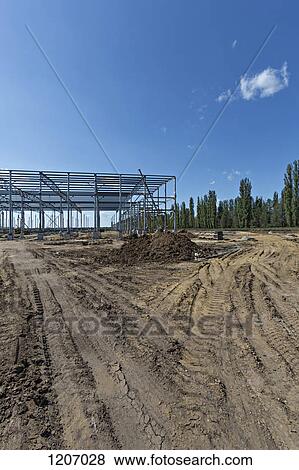 Split dirt path leading to construction frame View Large Photo Image Stock Photo - Split dirt path leading to construction frame. Fotosearch