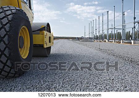 Steamroller on gravel road View Large Photo Image Stock Image - Steamroller on gravel road. Fotosearch