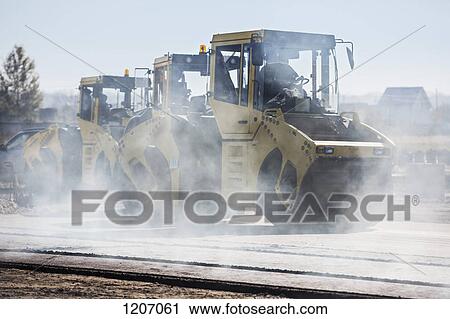 Steamrollers at work View Large Photo Image Stock Image - Steamrollers at work. Fotosearch