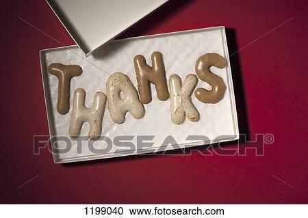 Stock Image - THANKS spelt in Russian bread cookies in a box. Fotosearch